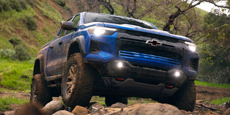 Front of blue 2026 Chevrolet Colorado driving in woods near Woodruff, SC